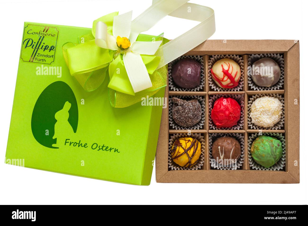 Box of Easter chocolates from Confiserie Pillipp Zirndorf Furth - Frohe Ostern with lid removed to show contents isolated on white background Stock Photo