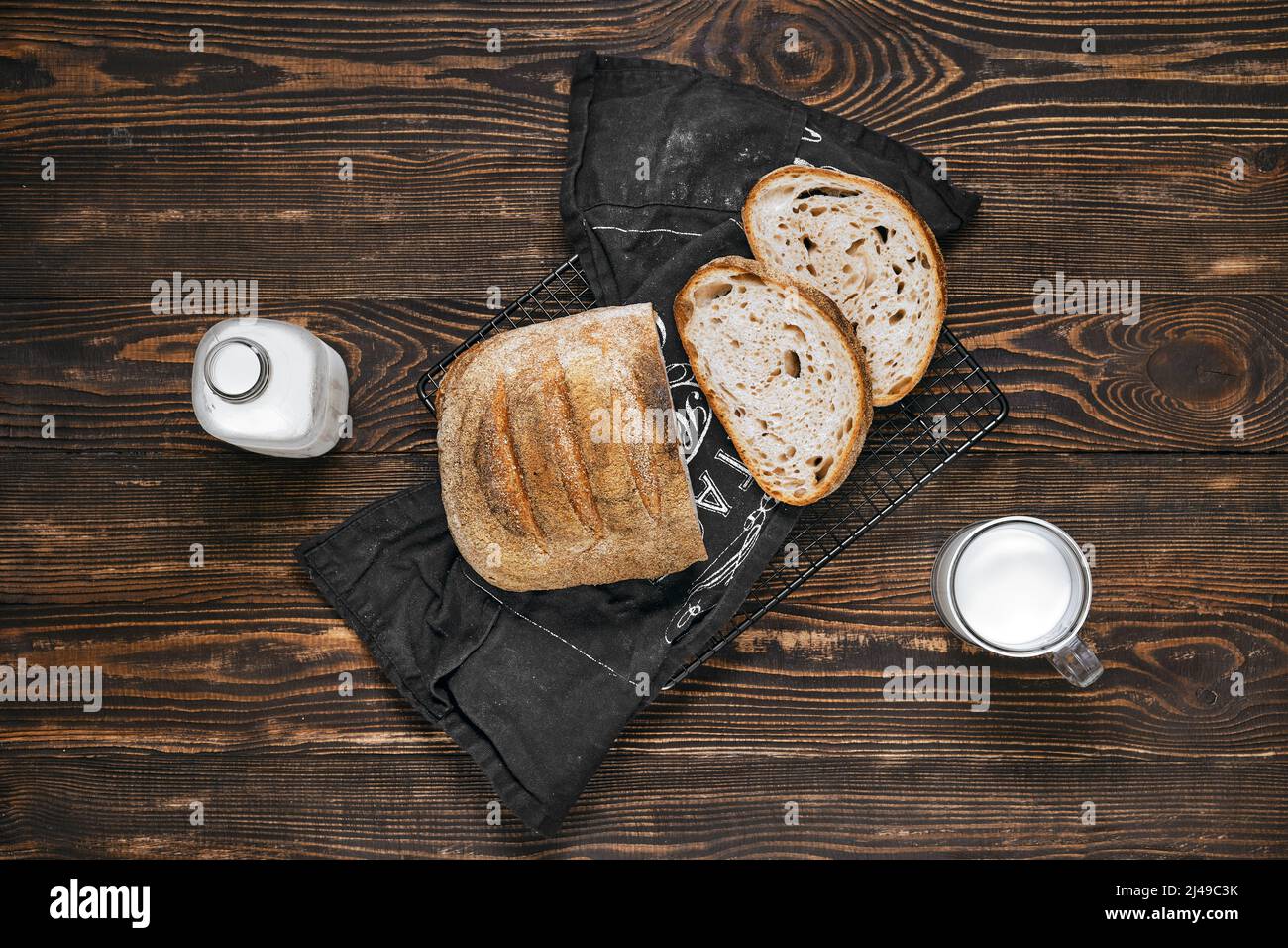 Overhead view of loaf of artisan sourdough bread with porous texture on
