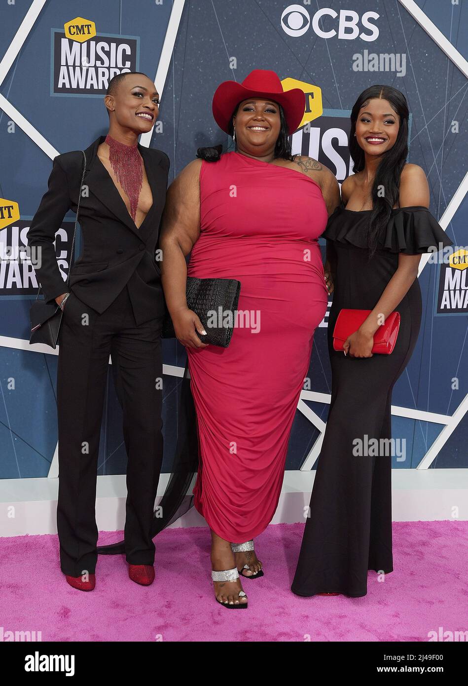 Chapel Hart Trea Swindle, Danica Hart, and Devynn Hart attend the