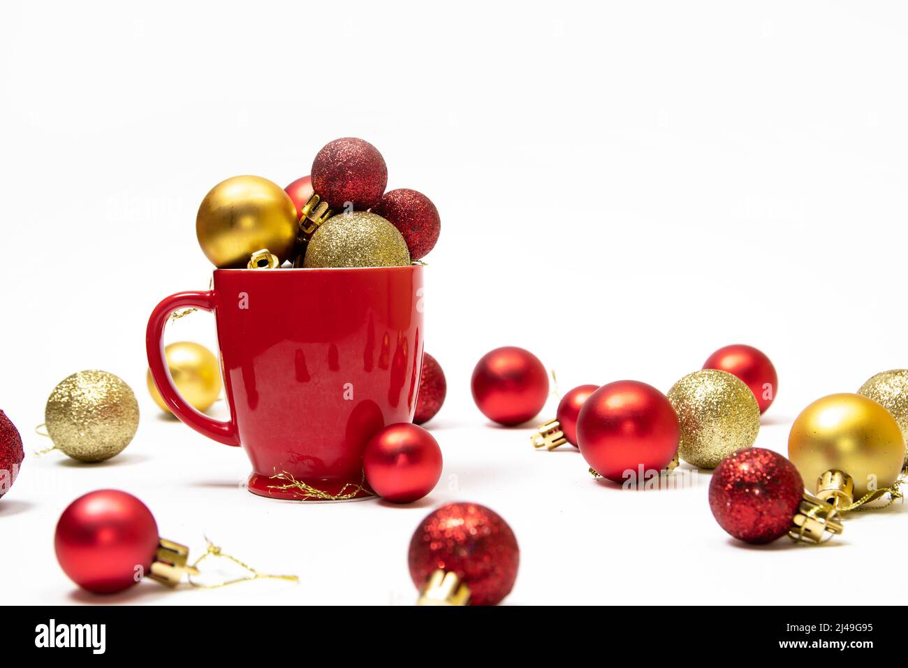 Christmas background with red and gold ornaments in a red cup Stock