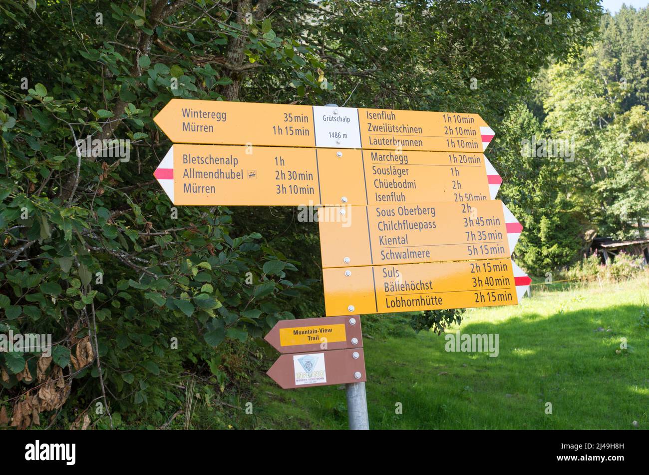 Waypoints with yellow direction signs along a hiking path leading to a  Mountain-View Trail near Grütschalp, Lauterbrunnen in Switzerland Stock  Photo - Alamy