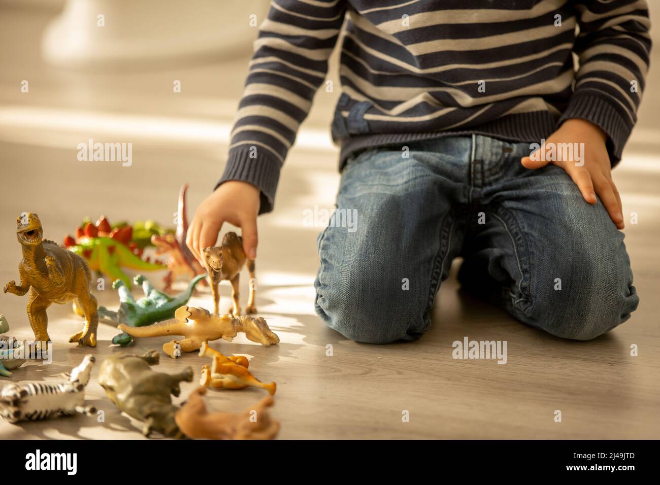 Little toddler child, boy, pee in his pants while playing with toys