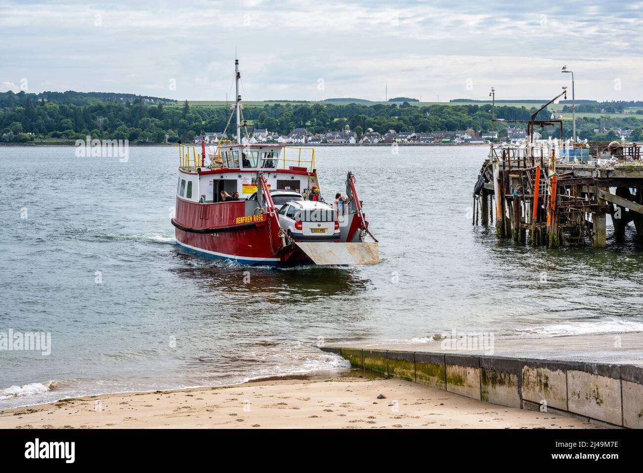 Ferry arriving at Nigg Ferry Terminal, with old Balintraid Pier in background – Nigg, Easter Ross Peninsula, Ross and Cromarty, Highland, Scotland, UK Stock Photo