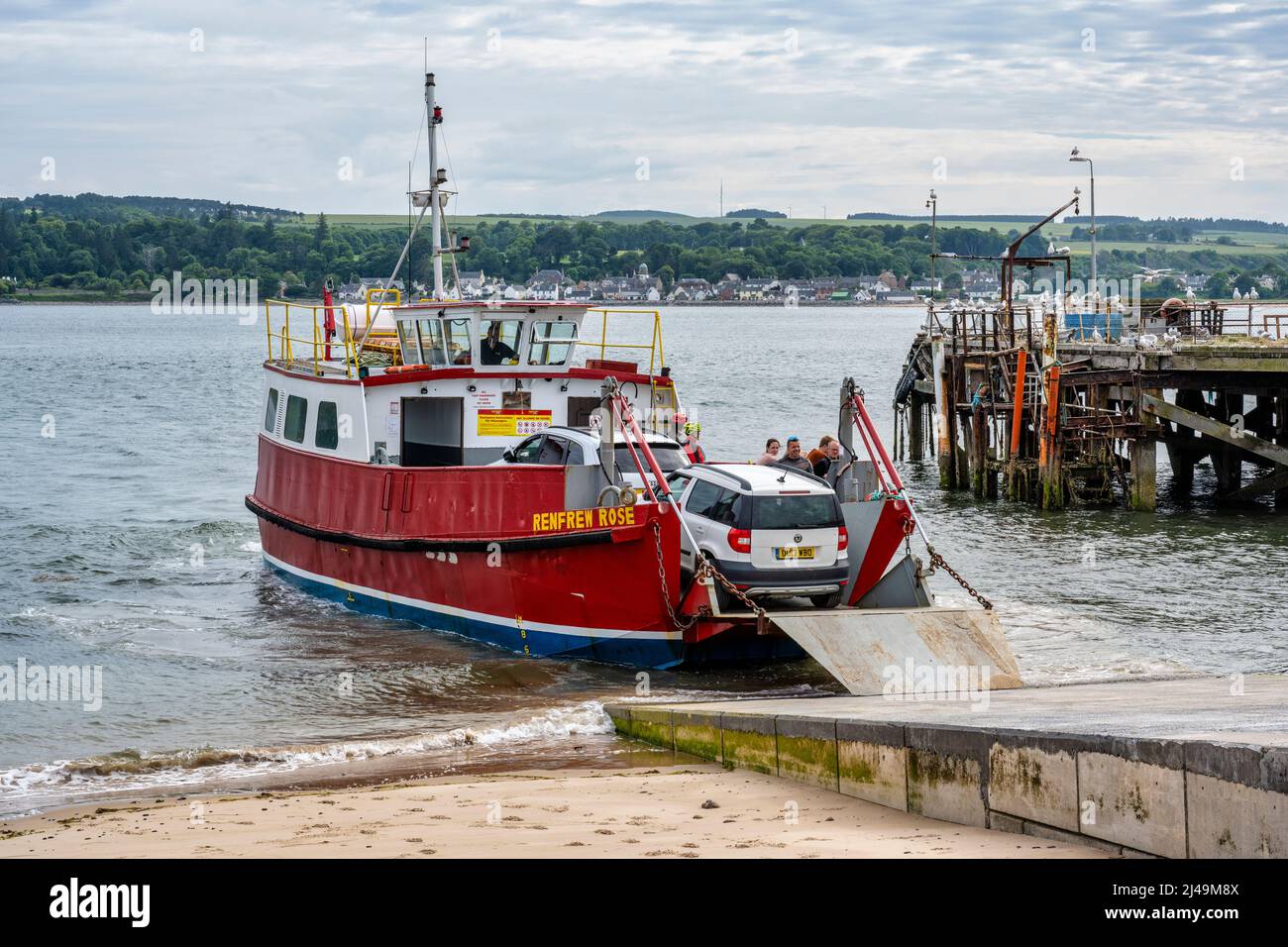 Ferry arriving at Nigg Ferry Terminal, with old Balintraid Pier in background – Nigg, Easter Ross Peninsula, Ross and Cromarty, Highland, Scotland, UK Stock Photo