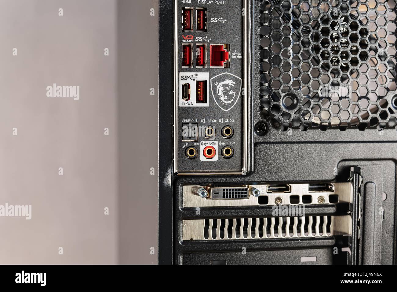 The back of a personal computer system unit. Black case with ventilation  grille and connectors for graphics, network and sound card. HDMI and USB  corr Stock Photo - Alamy