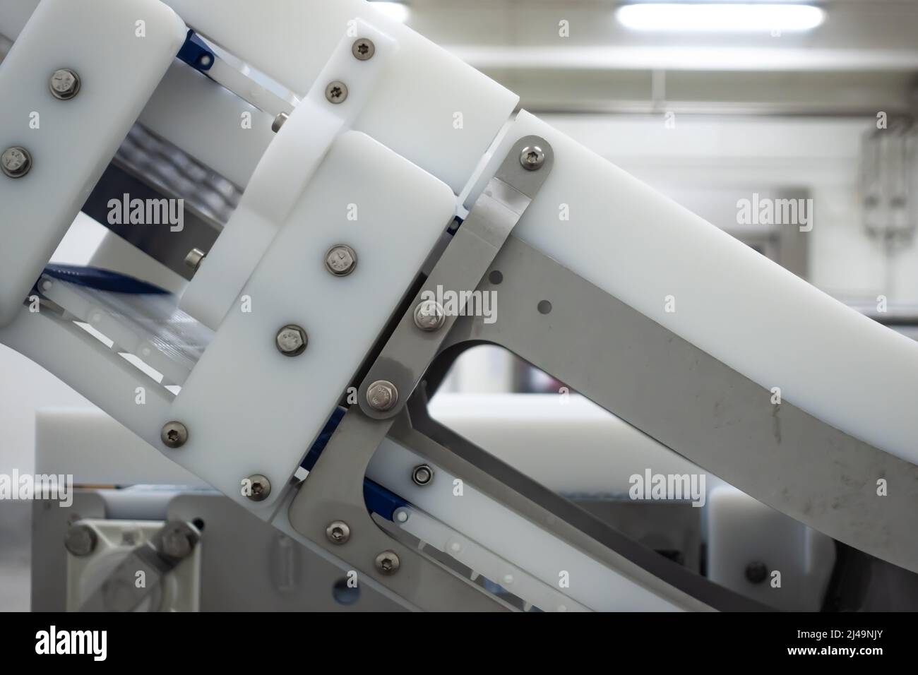 Modular belt conveyor in a food processing plant. A closeup of the