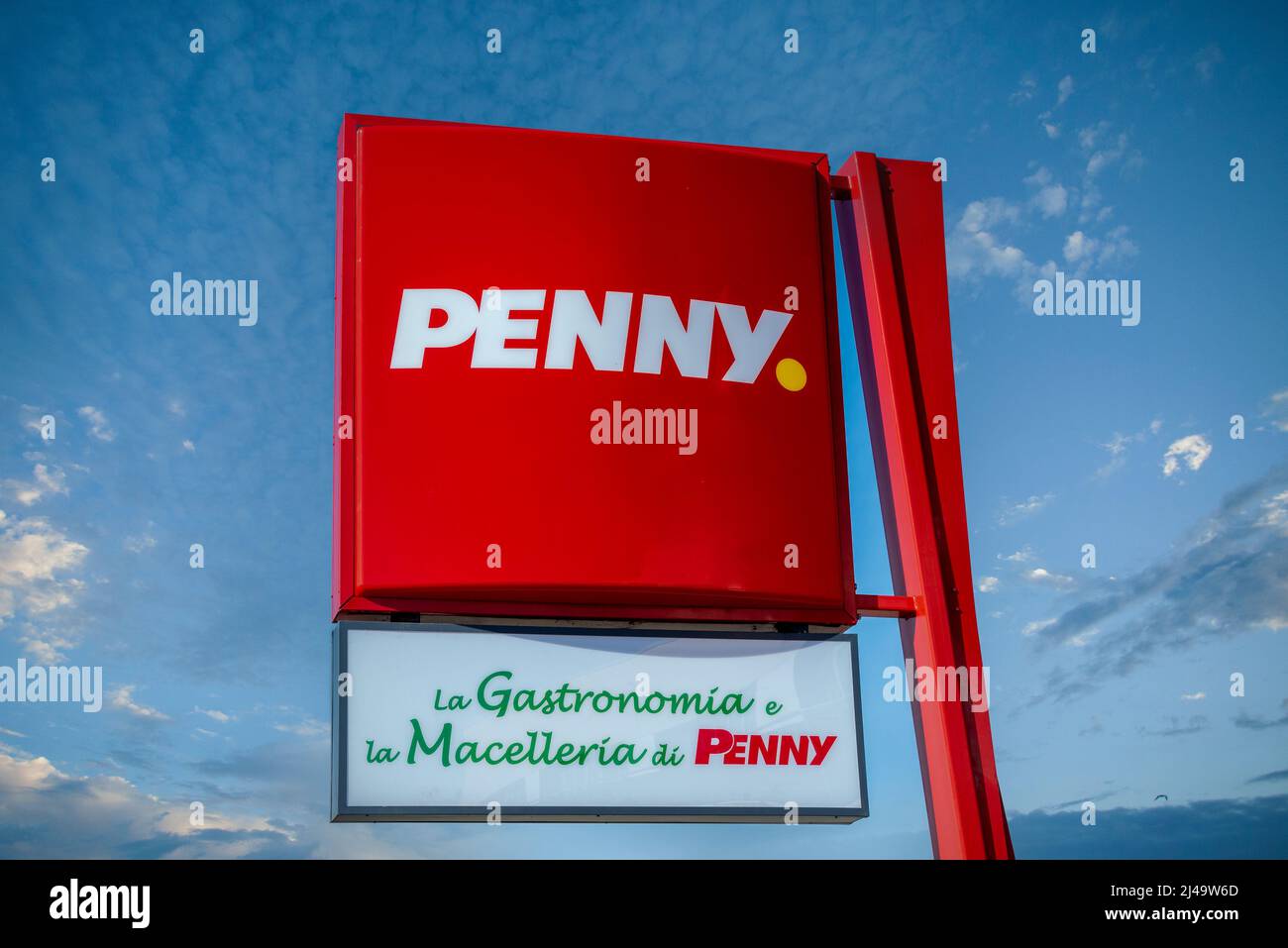 Asti, Italy - April 07, 2022: sign with Penny Market discount logo, supermarket of German origin of the Rewe Group. Tex: La Gastromonia e la Macelleri Stock Photo