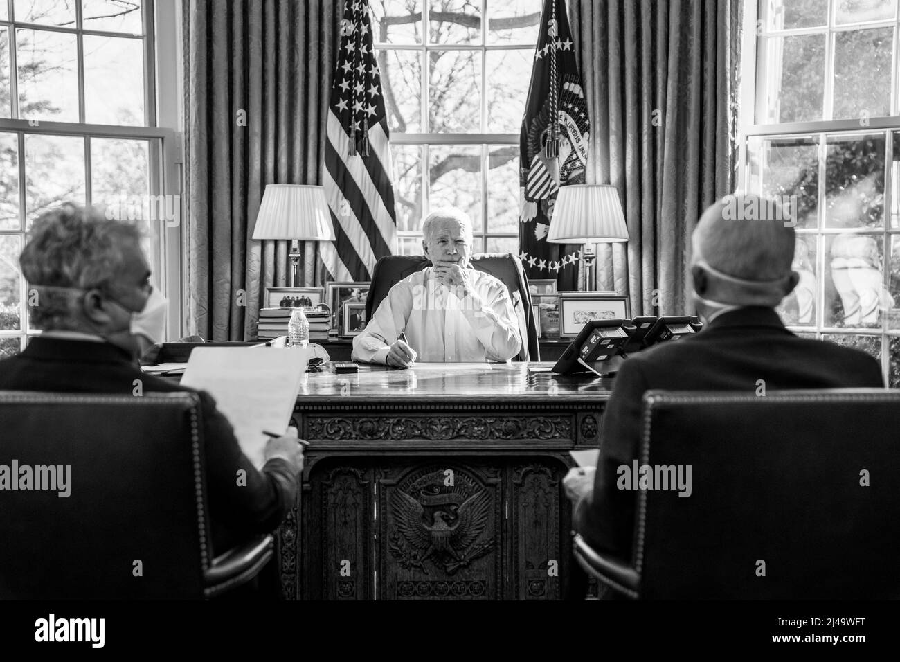President Joe Biden meets with staff about COVID-19, Sunday, February 20, 2022, in the Oval Office of the White House. (Official White House Photo by Adam Schultz) Stock Photo