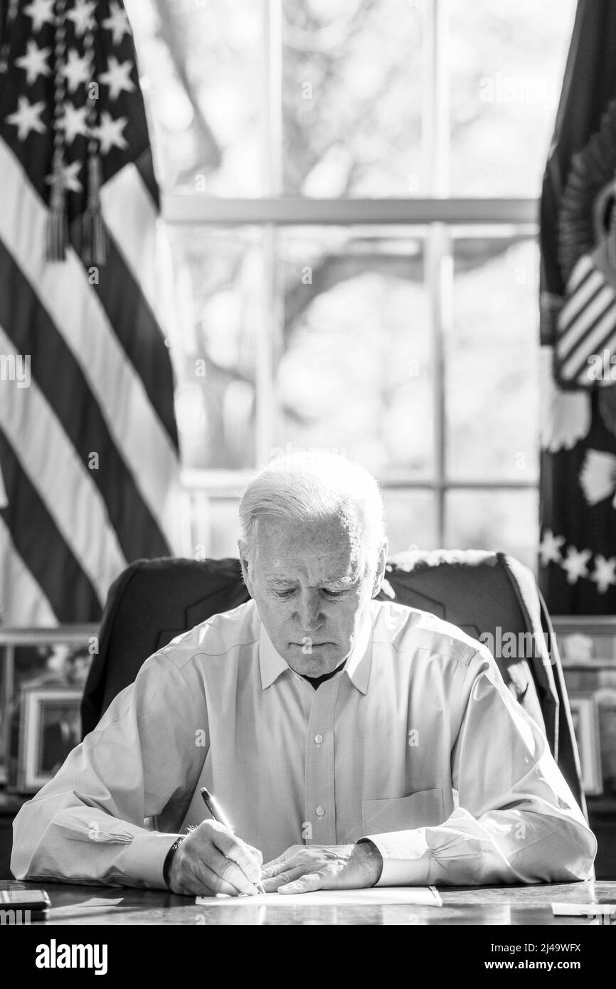 President Joe Biden meets with staff about COVID-19, Sunday, February 20, 2022, in the Oval Office of the White House. (Official White House Photo by Adam Schultz) Stock Photo