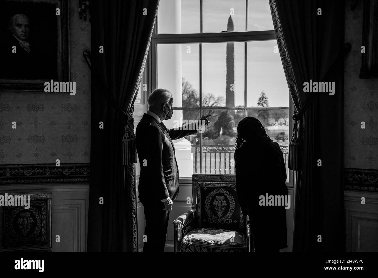 President Joe Biden looks out of the Blue Room window with Judge Ketanji Brown Jackson, Friday, February 25, 2022, prior to announcing her nomination to the U.S. Supreme Court. (Official White House Photo by Adam Schultz) Stock Photo