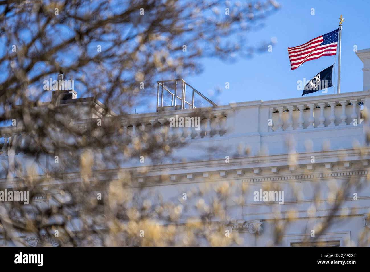 The American flag and the POW/MIA flag fly over the White House, Friday