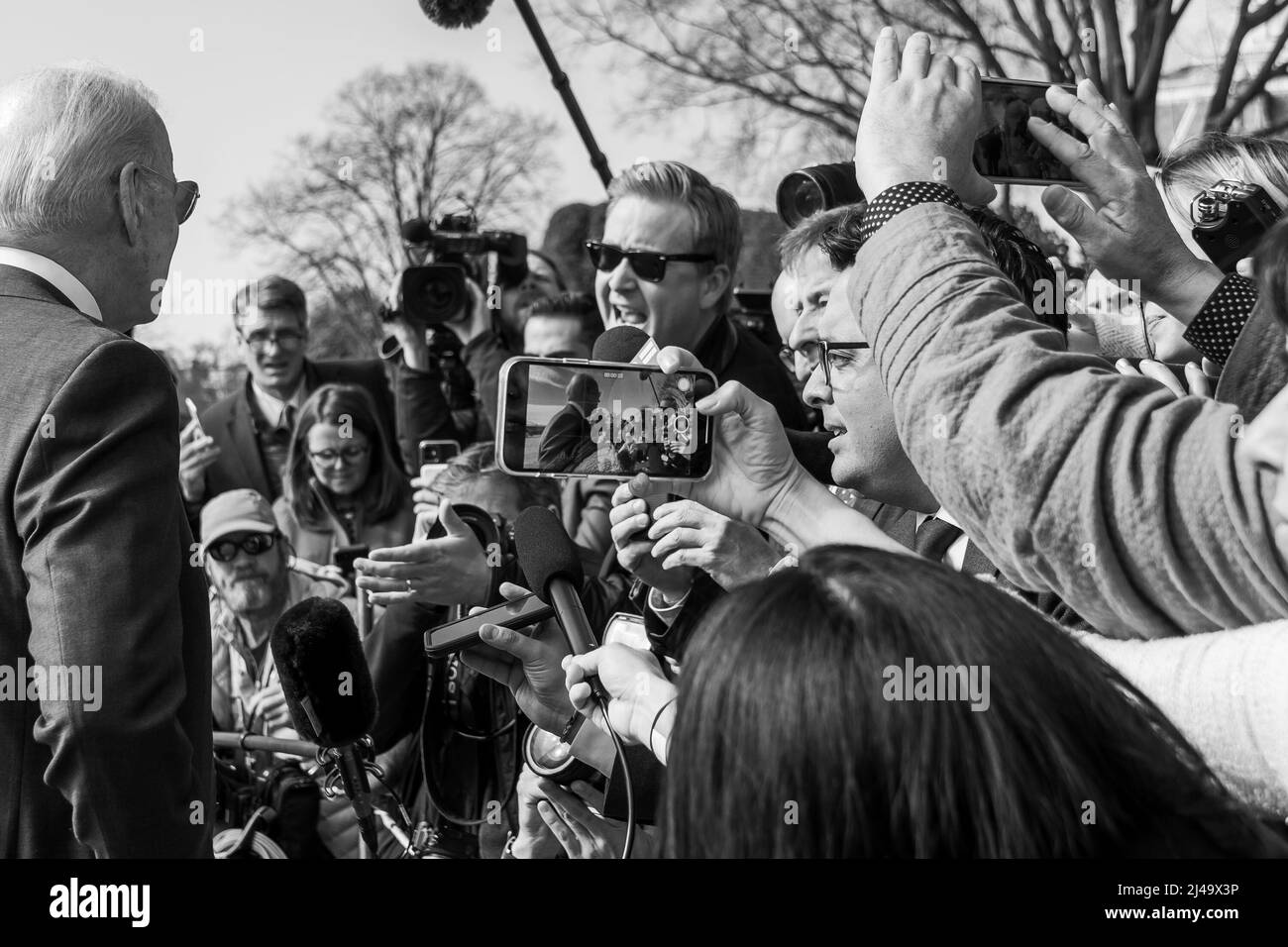 President Joe Biden speaks with members of the press before boarding Marine One on the South Lawn of the White House, Wednesday, March 2, 2022. (Official White House Photo by Cameron Smith) Stock Photo