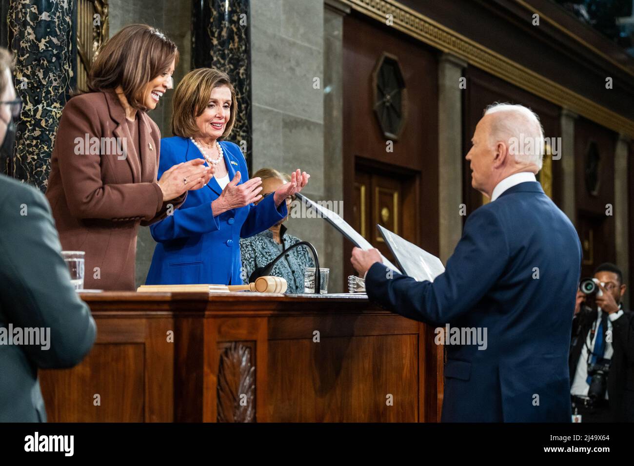 President Joe Biden presents copies of his State of the Union address to Vice President Kamala Harris and House Speaker Nancy Pelosi before delivering the address to a joint session of Congress, Tuesday, March 1, 2022, in the House Chamber at the U.S. Capitol in Washington, D.C. (Official White House Photo by Adam Schultz) Stock Photo