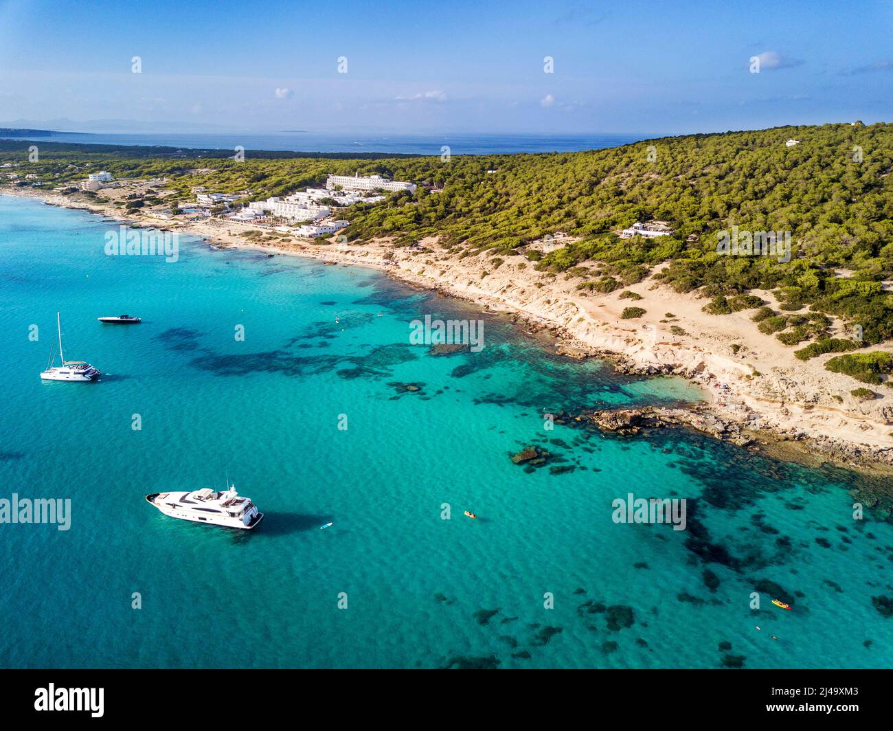Coastal first line in Es Arenals beach in the Arenal beach coastal near es Caló d´es mort cala beach, with green wild nature and rocks in fornt of tur Stock Photo