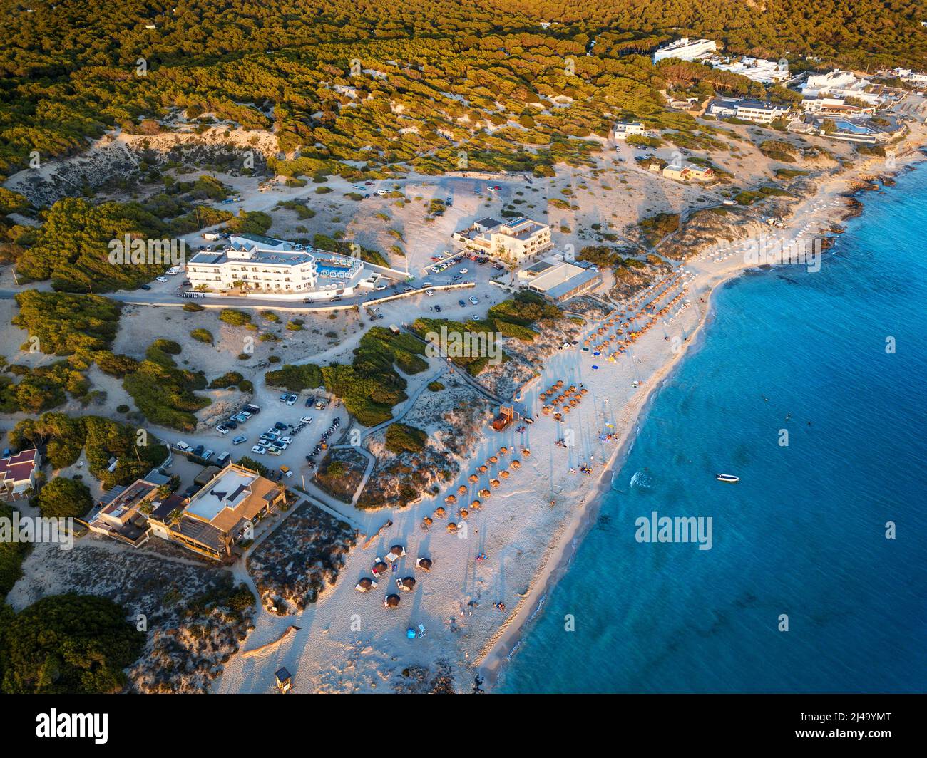 Aerial view in sunset time in a famous Plata de Mijorn beach, Formentera (Balearic Islands). Maysi Hotel and Hotel Riu La Mola Hotel. Stock Photo
