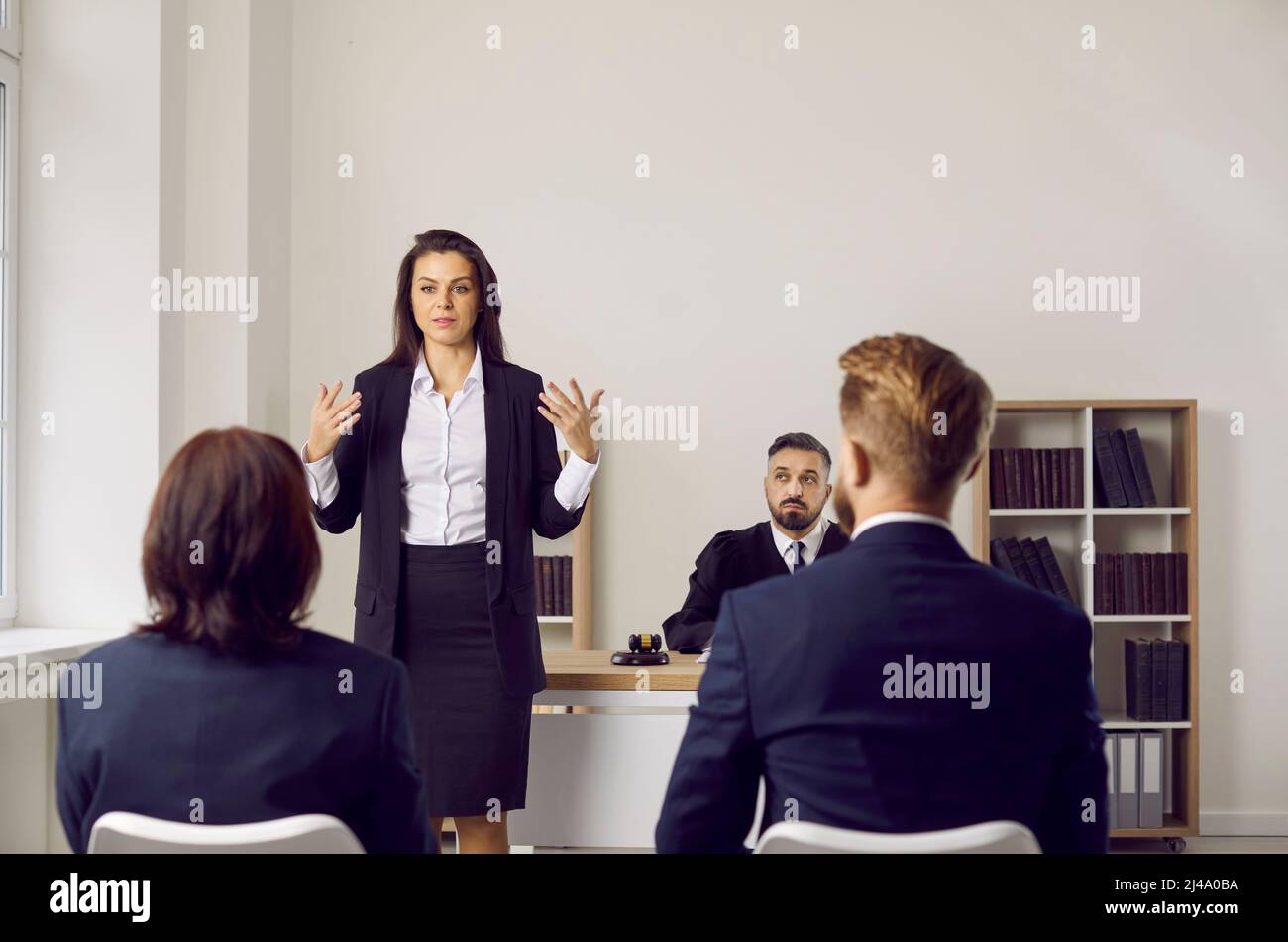 Defense lawyer or plaintiff attorney making a speech during a court trial hearing Stock Photo