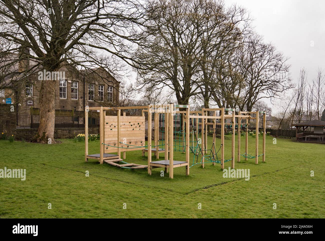 Outdoor,all weather,modular,wooden & steel playground equipment completed at Long Preston Endowed school & now seen 6m post completion as @ April 2022 Stock Photo