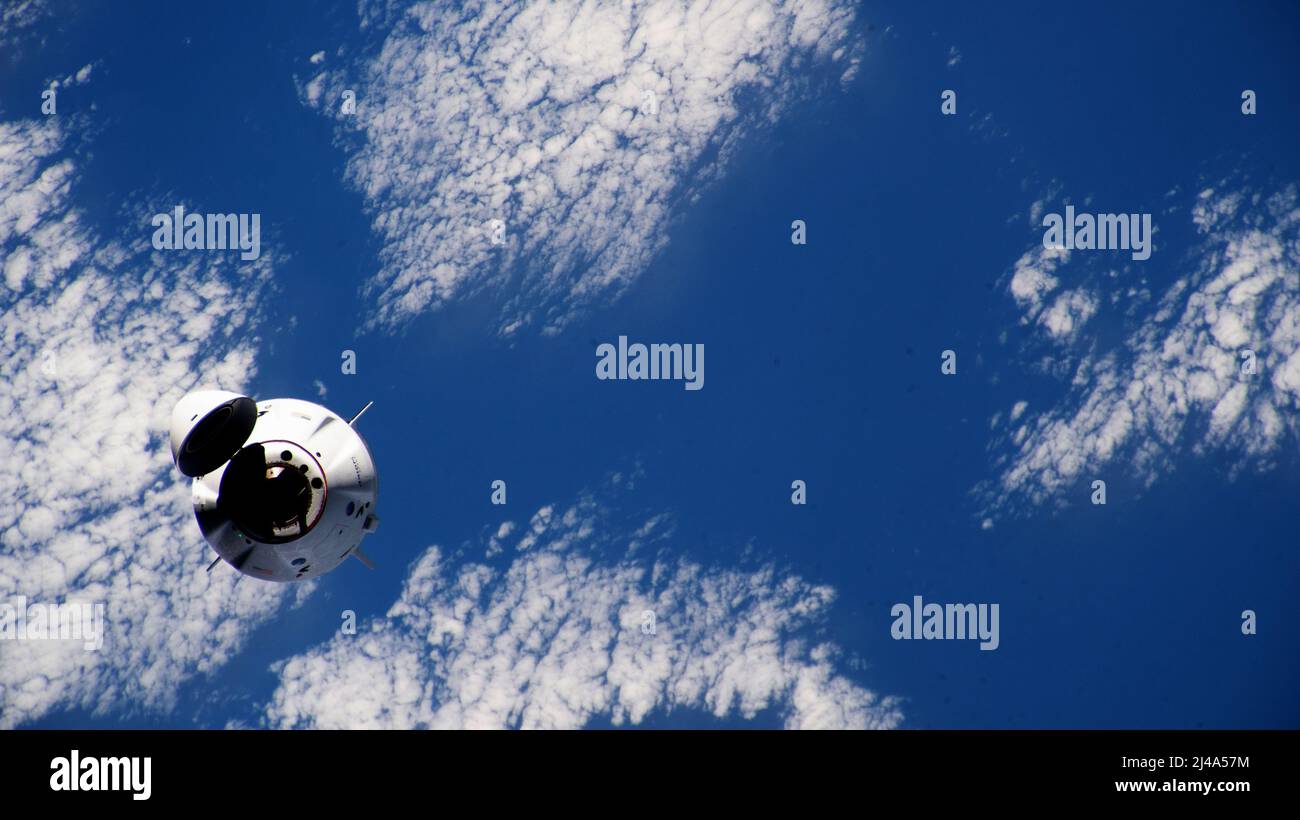 ISS - 09 April 2022 - The SpaceX Dragon Endeavour crew ship carrying four Axiom Mission 1 astronauts approaches the International Space Station less t Stock Photo