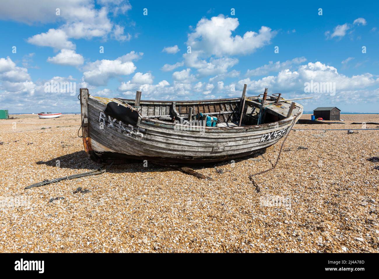 Derelict fishing boat on shingle beach hi-res stock photography and ...