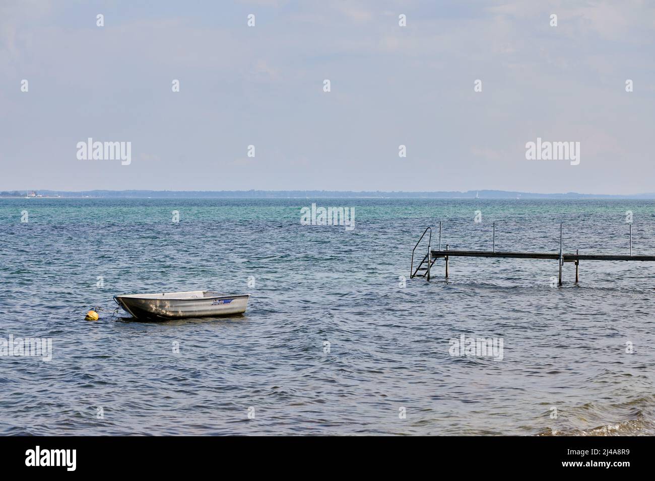 Dinghy and bathing jetty, summer; Rørvig, Denmark Stock Photo