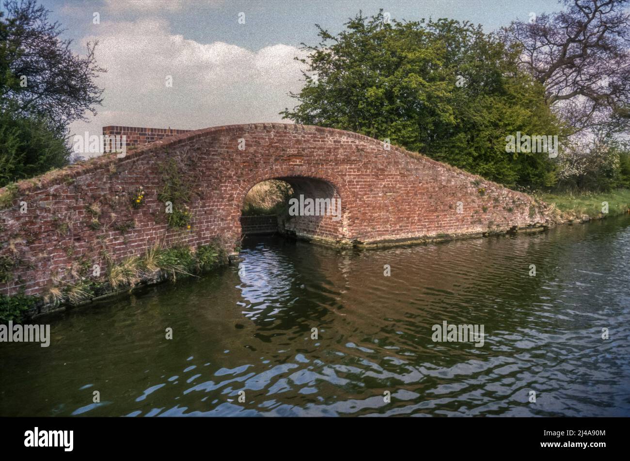 Bridge 142 on the Oxford Canal over the remains of the feeder from Boddington Reservoir. Stock Photo