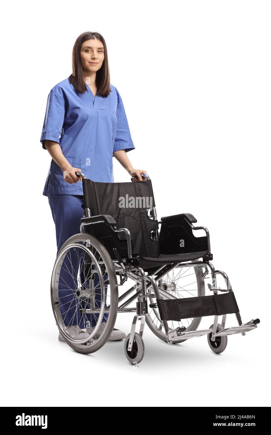 Female nurse standing with an empty wheelchair isolated on white