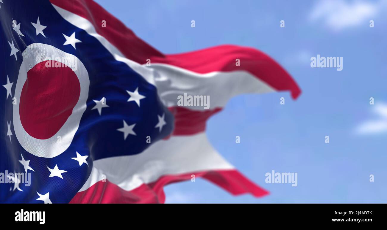 The US state flag of Ohio waving in the wind. Ohio is a state in the Midwestern region of the United States. Democracy and independence. Stock Photo