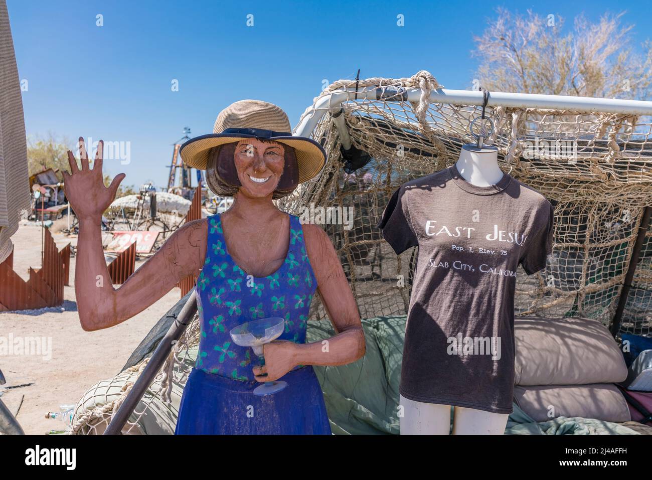 A waving cutout female figure in East Jesus, California. East Jesus is an off-the-grid art community in the Sonoran Desert of Southern California. The Stock Photo
