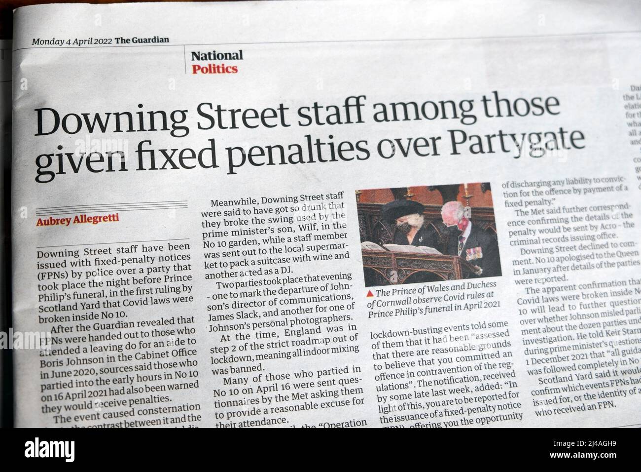 'Downing Street staff among those given fixed penalties over Partygate' Guardian newspaper headline covid article clipping on 4 April 2022 London UK Stock Photo
