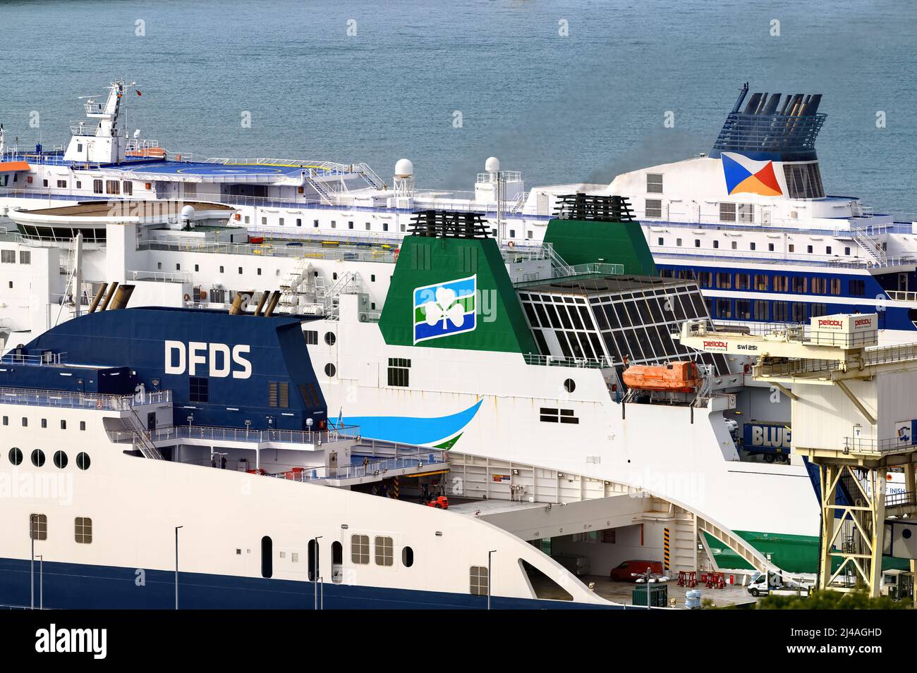 Brand logos on the funnels of the three cross-Channel ferry operators at the Port of Dover - DFDS, Irish Ferries and P&O Ferries - August 2021. Stock Photo