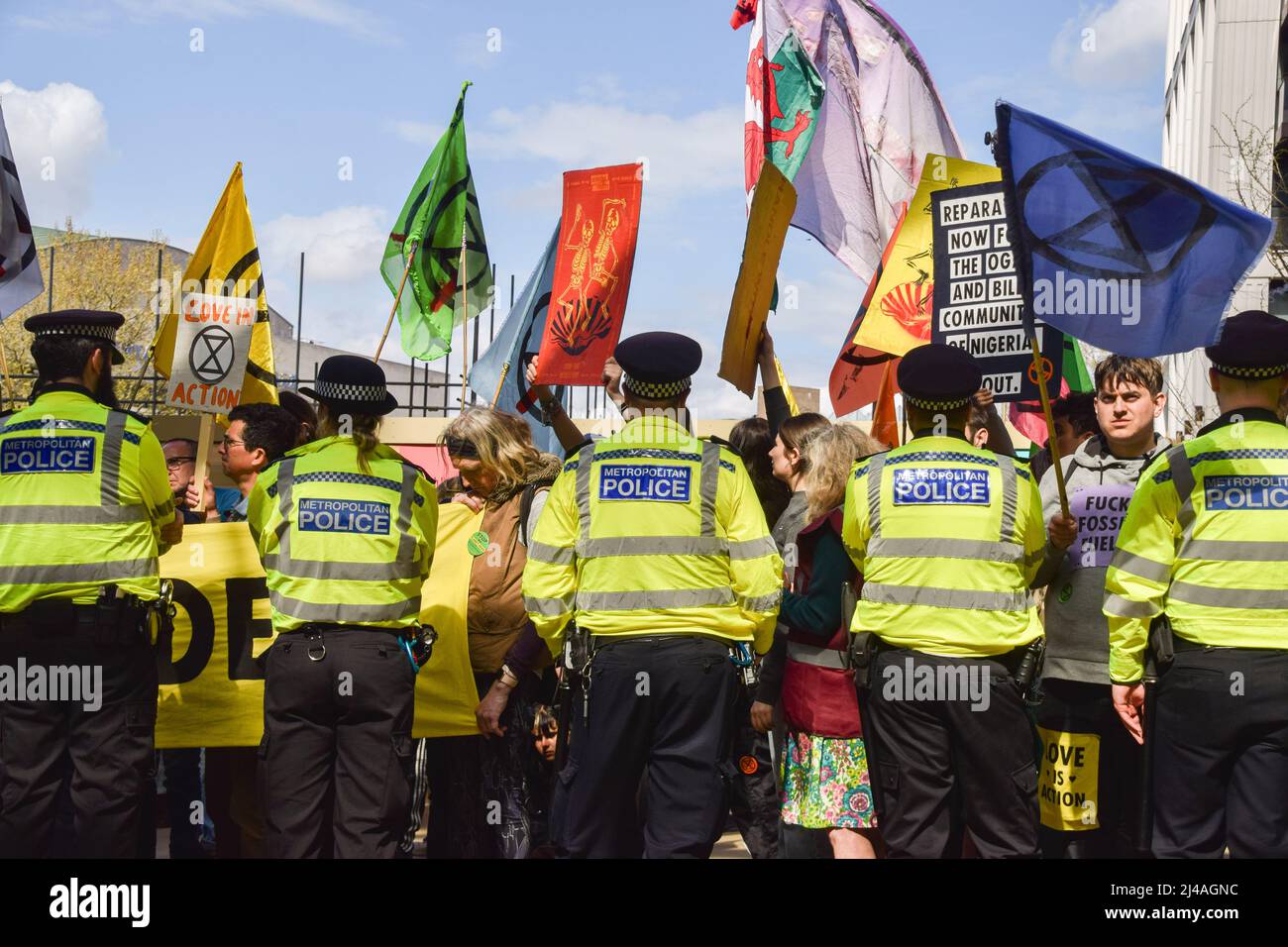 London, England, UK. 13th Apr, 2022. Police guard the entrance. Extinction Rebellion activists caused chaos at the London headquarters of oil giant Shell, with dozens of protesters gluing themselves to the floor outside the entrance and several inside the building. (Credit Image: © Vuk Valcic/ZUMA Press Wire) Stock Photo