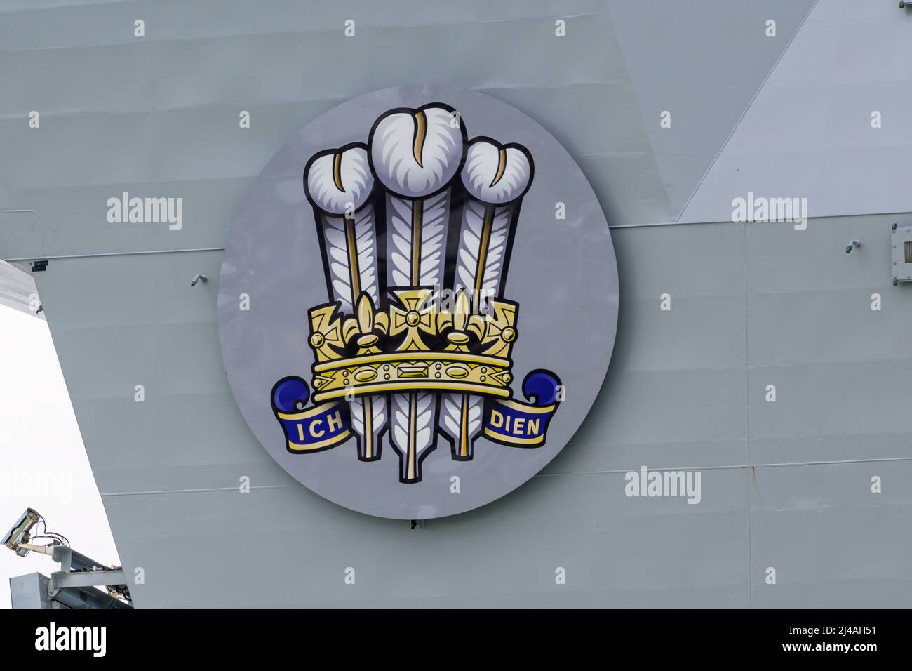 The coat of arms of the Prince of Wales, as worn by the Royal Navy aircraft carrier HMS Prince of Wales (R09) - May 2021. Stock Photo