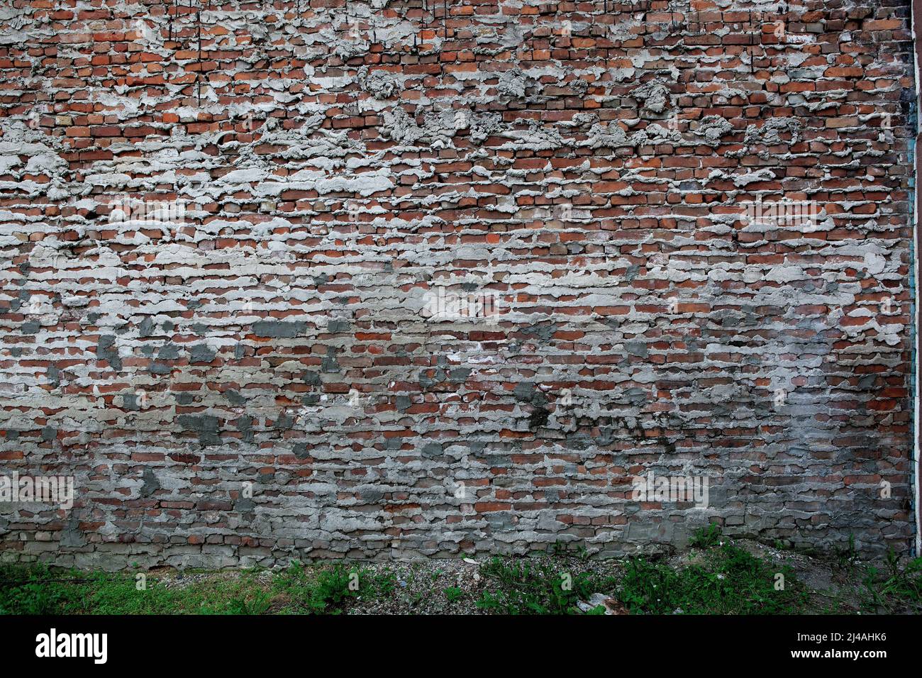 Red brick wall with mortar and cement seepage suitable for wallapers backgrounds or compsite creations. Stock Photo