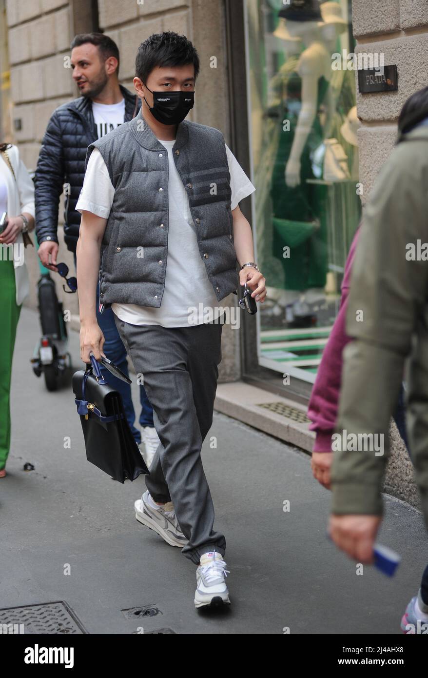 Milan, . 13th Apr, 2022. Milan, 13-04-2022 Steven Zhang, 30 years old, Chinese entrepreneur and President of INTER and SUNING INTERNATIONAL, after having parked his car that he usually uses in the city to go to work, sets off towards the offices, trying to walk among the people in order not to be noticed and photographed. Credit: Independent Photo Agency/Alamy Live News Stock Photo