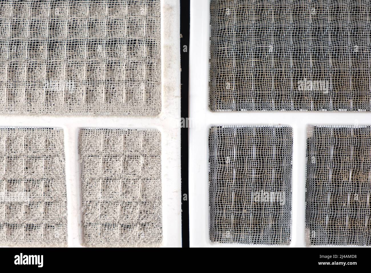 Dirty and clean air conditioner filters. Cleaning the filter from dust