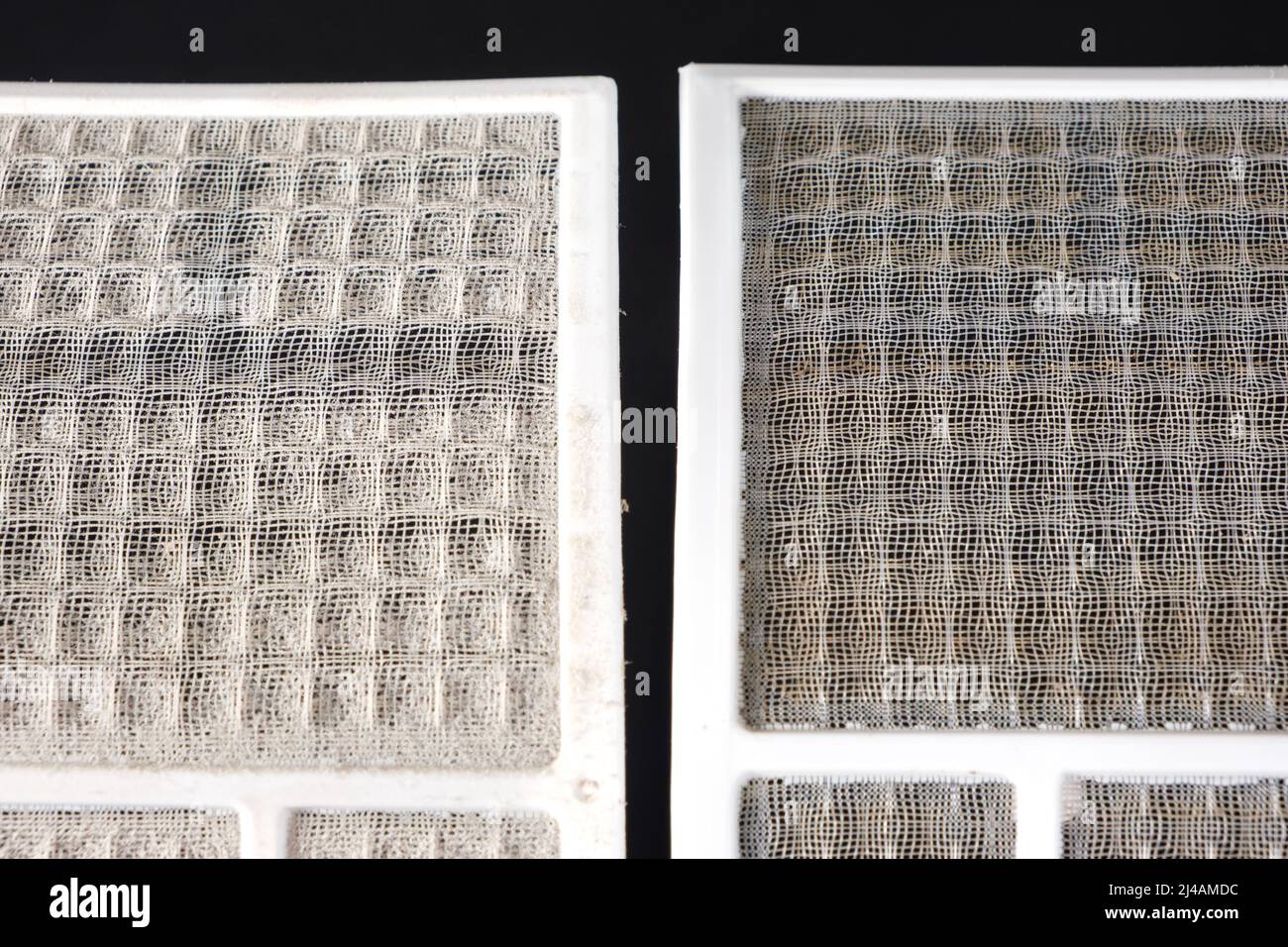 Dirty and clean air conditioner filters. Cleaning the filter from dust