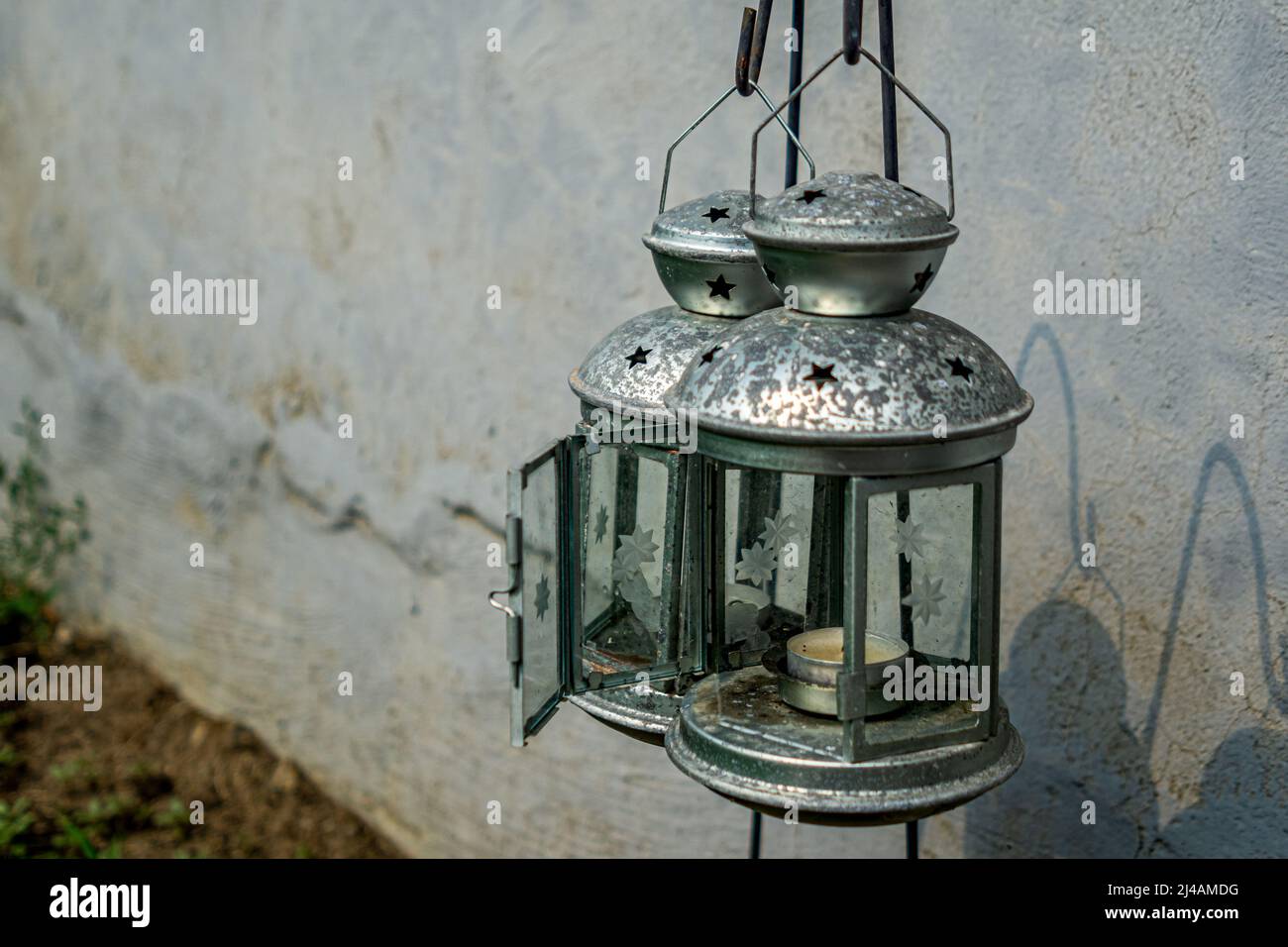 Hanging metal lantern hi-res stock photography and images - Alamy