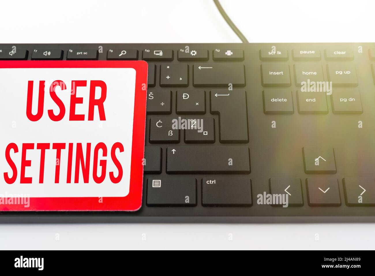 Hand writing sign User Settings. Conceptual photo Configuration of appearance Operating System Personalized Computer Keyboard And Symbol.Information Stock Photo