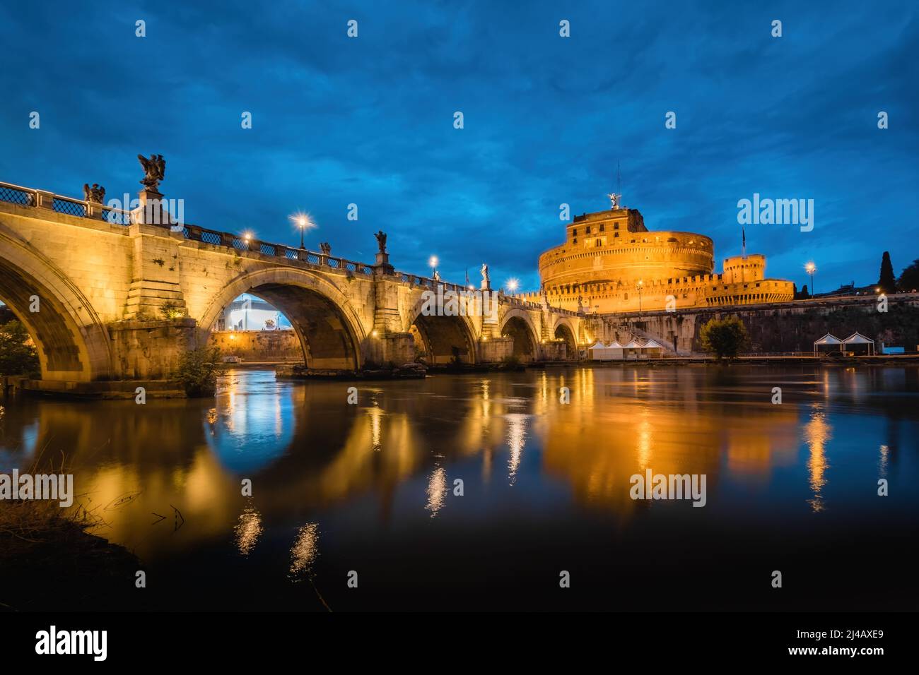 Mausoleum of Hadrian or Castel Sant'Angelo in Rome, Italy under the Blue Hour Sky at Dusk Stock Photo