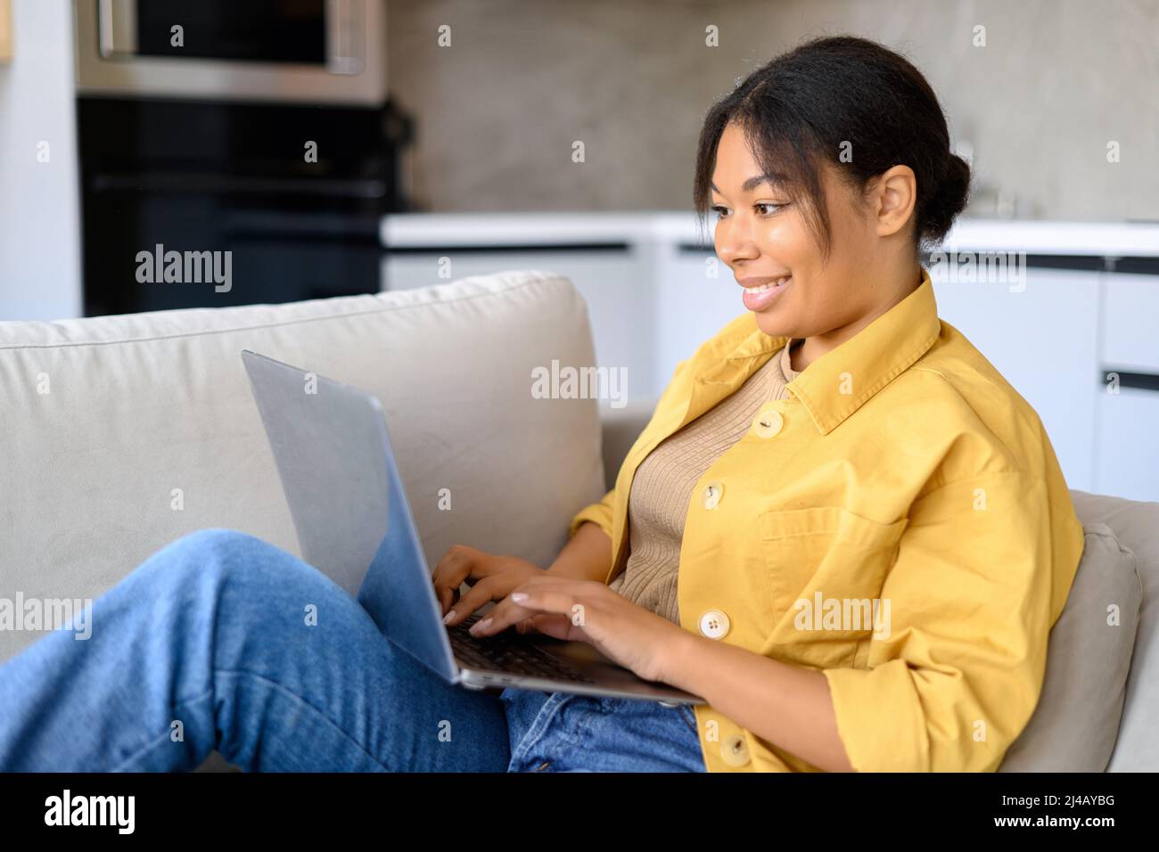 African woman sitting alone side view hi-res stock photography and ...