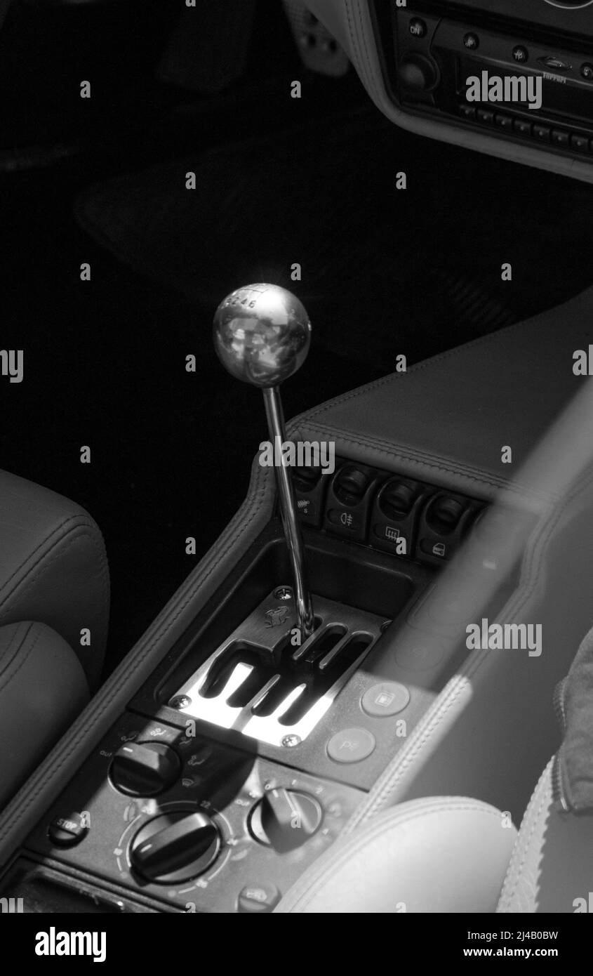 ITALY , BARDOLINO - APRIL 10, 2022:Save Download Preview Manual gear shift knob close up shot on an old FERRARI Stock Photo