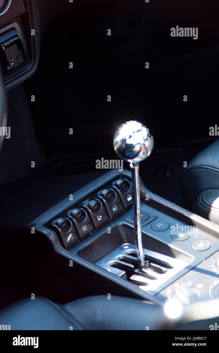 ITALY , BARDOLINO - APRIL 10, 2022:Save Download Preview Manual gear shift knob close up shot on an old FERRARI Stock Photo