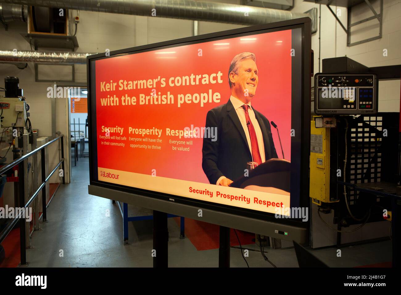 A Television screen reveals ‘Keir Starmer’s contract with the British people’ shortly before Labour leader Sir Keir Starmer speaks to local people to Stock Photo