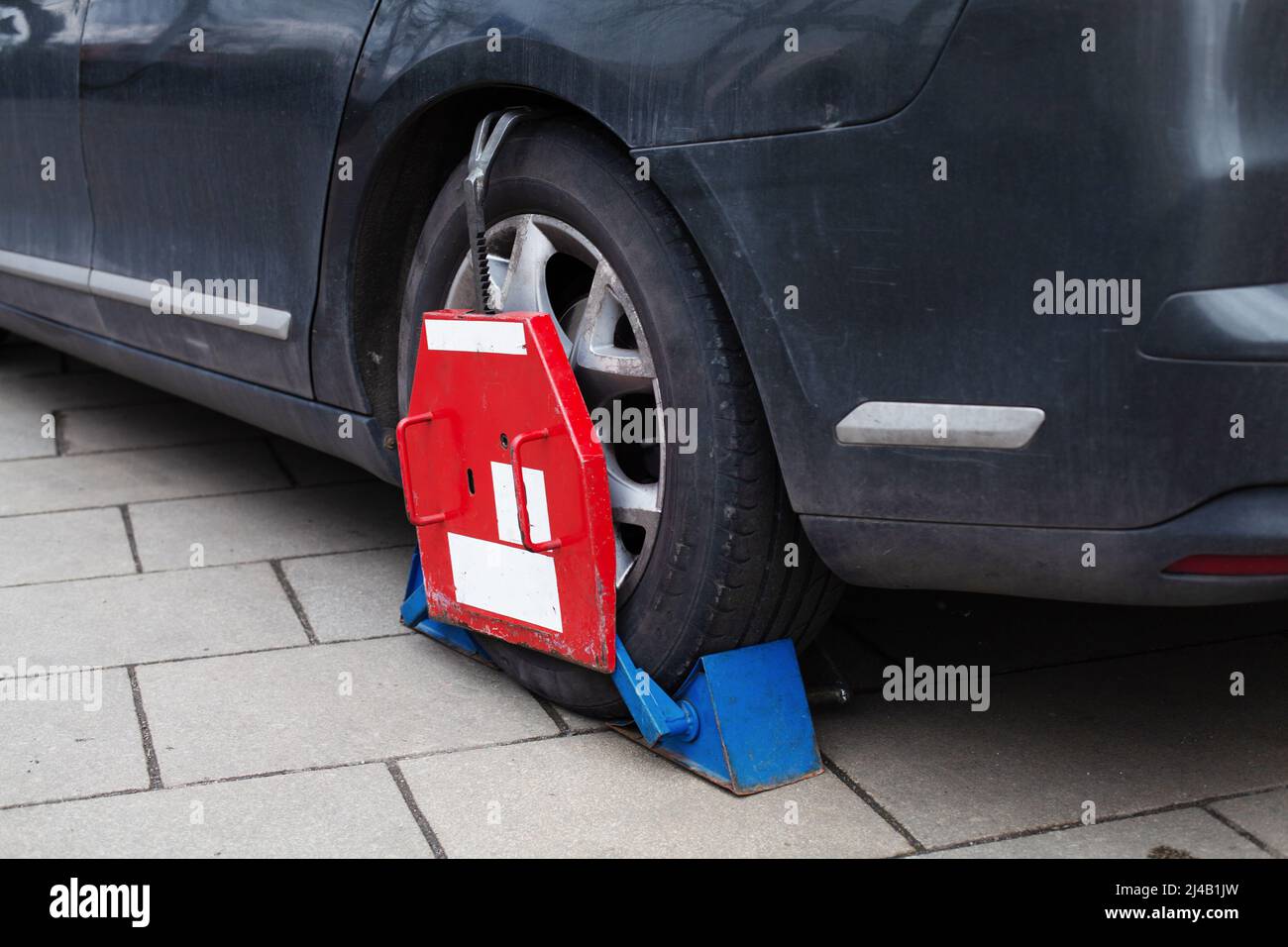Car wheel clamp Locked illegally parked cars Car wheel blocked by wheel