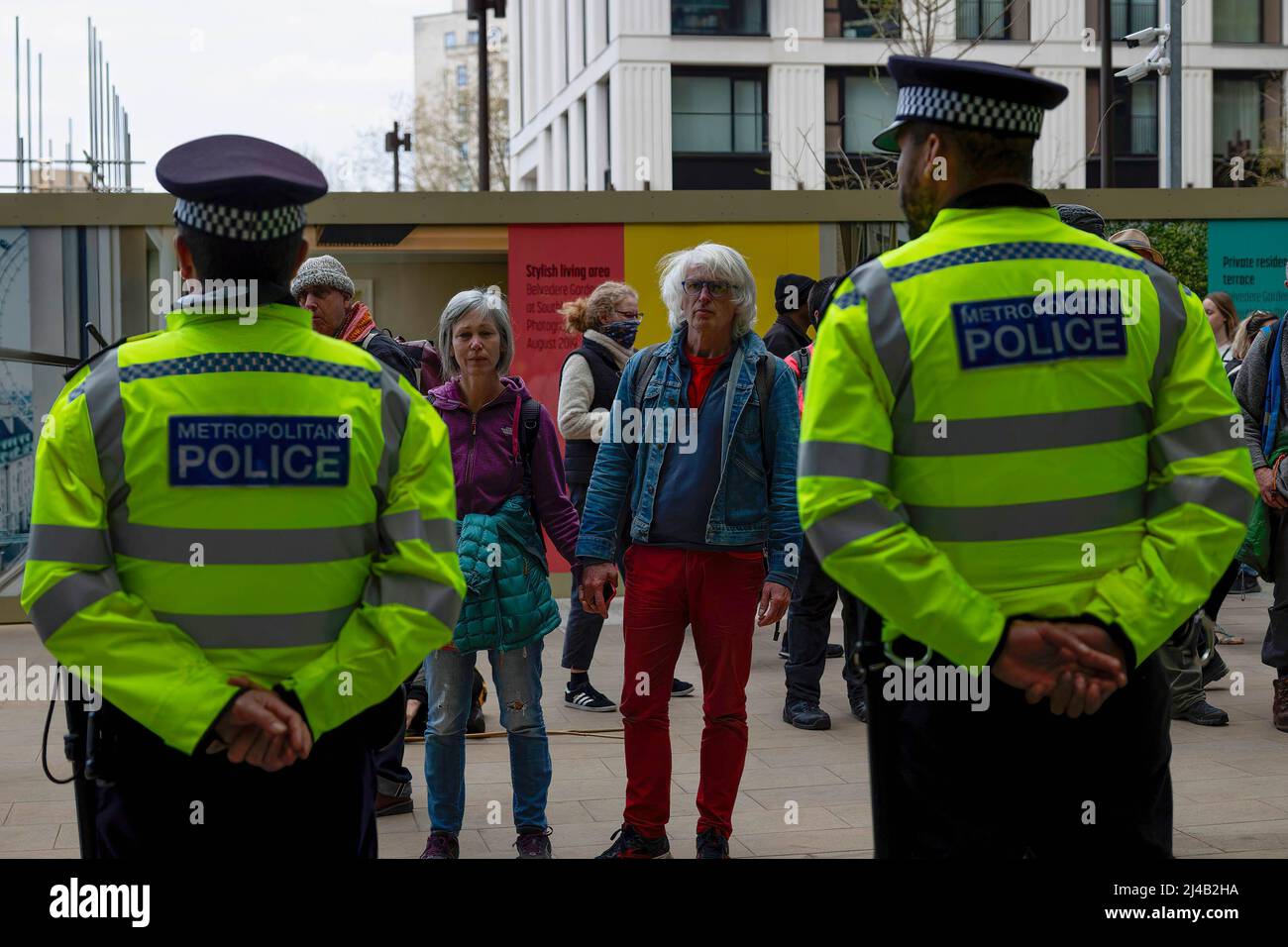 Two Protestors London, UK. 13th Apr, 2022. Two protesters confront police cordon ...