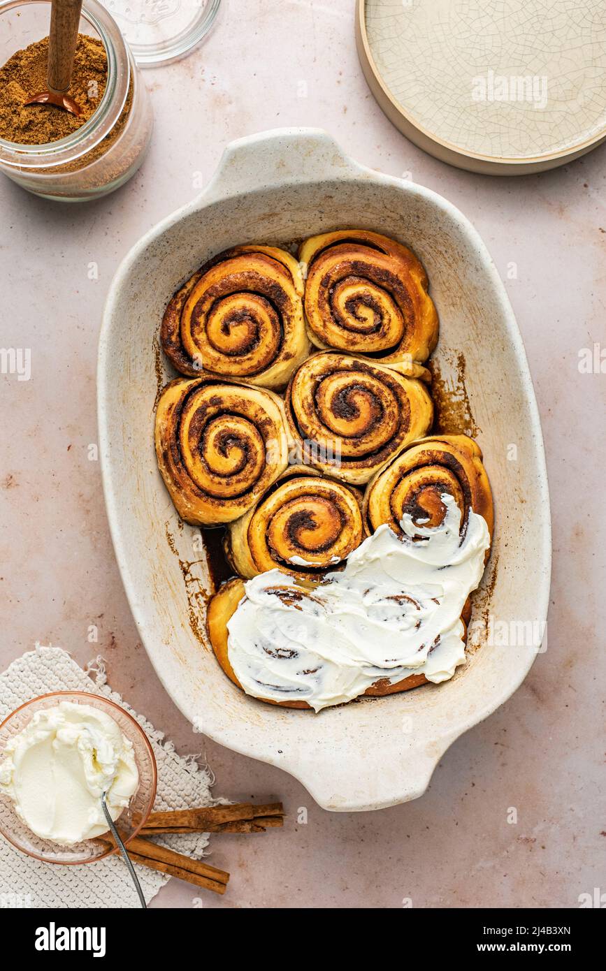 Homemade Cinnamon rolls against a pink background Stock Photo