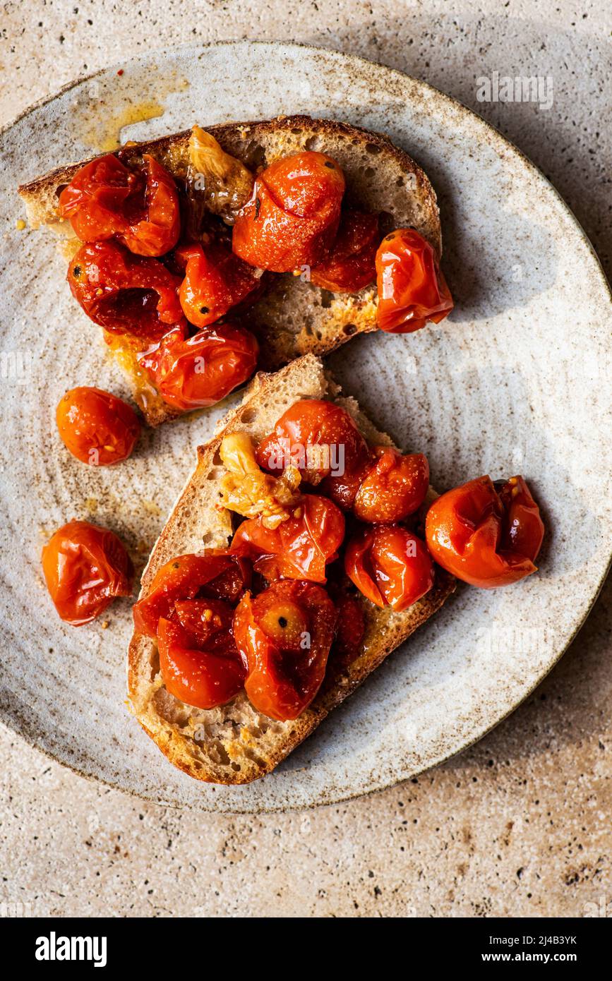 Tomato Confit Toast bruschetta snack Stock Photo Alamy