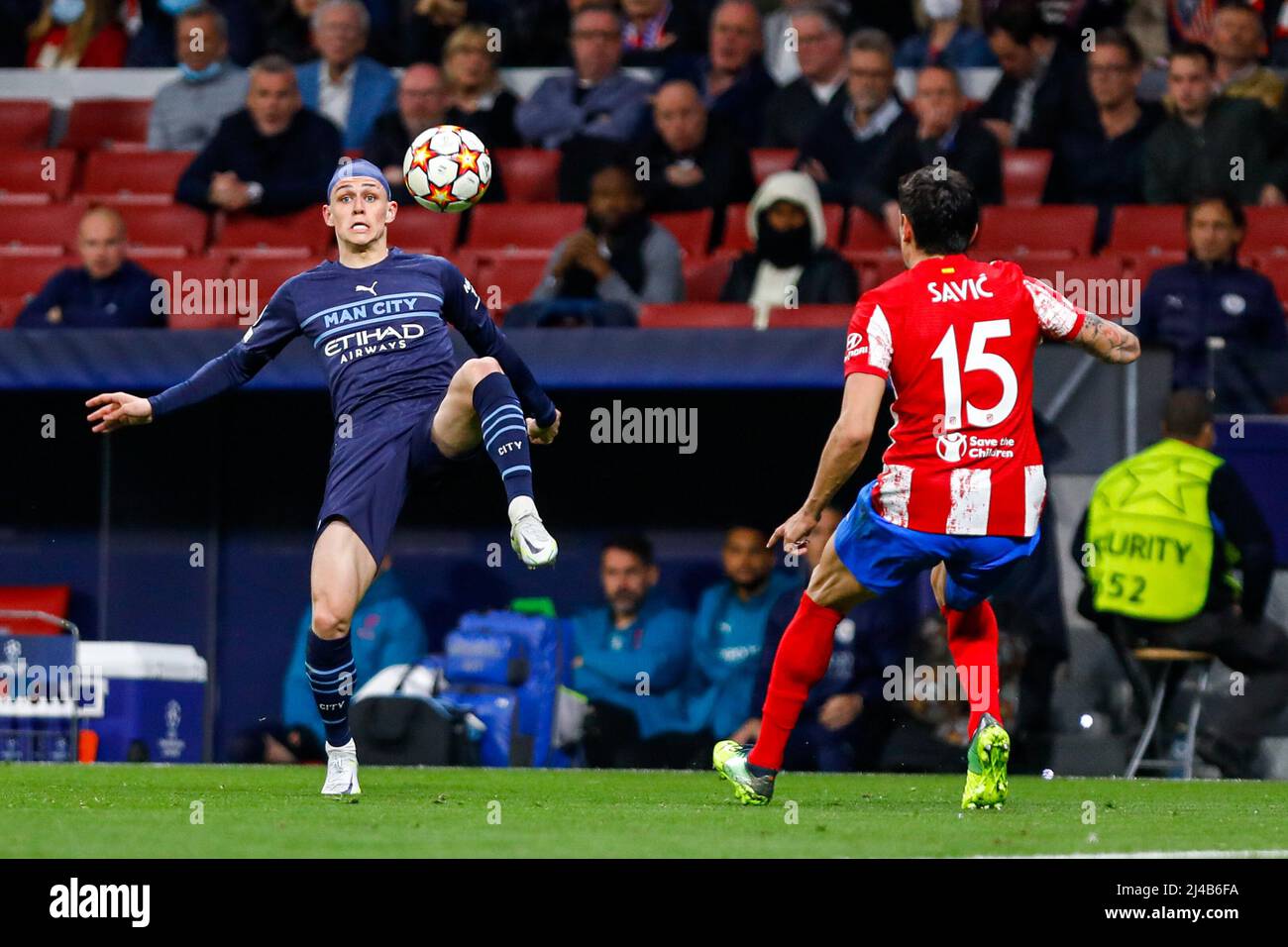 MADRID, SPAIN - APRIL 13: Phil Foden of Manchester City, Stefan Savic of Atletico Madrid during the UEFA Champions League Quarter-Finals, Second Leg match between Atlético Madrid and Manchester City at Wanda Metropolitano on April 13, 2022 in Madrid, Spain (Photo by DAX Images/Orange Pictures) Credit: Orange Pics BV/Alamy Live News Stock Photo