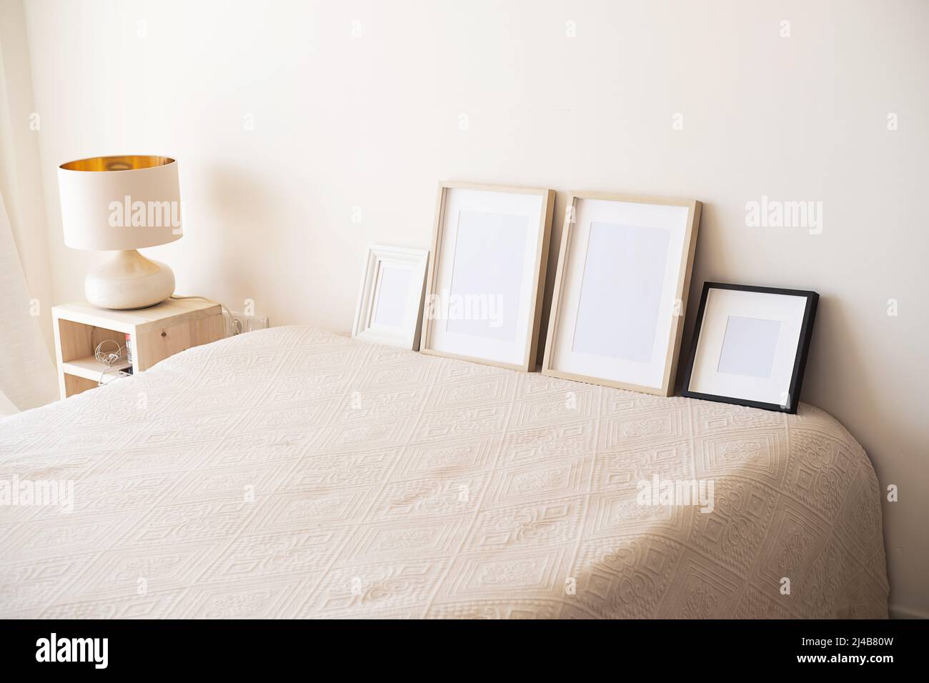 Wooden frames with empty space in the bedroom.  Stock Photo