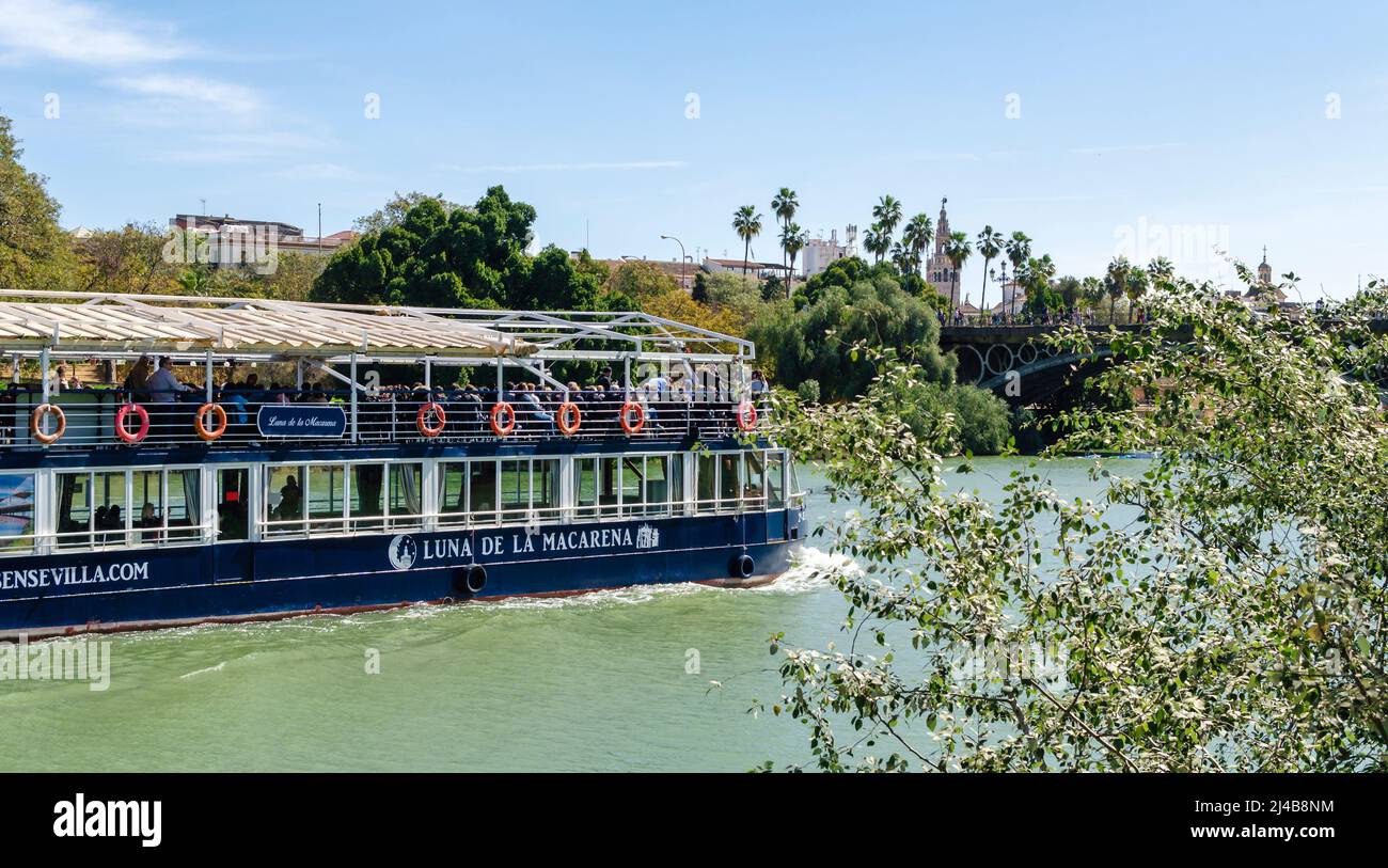 Seville, Spain; April 2, 2022: Guadalquivir river boat cruise Stock Photo